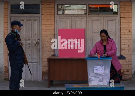 On December 1, 2024, in Kathmandu, Nepal. A Women casts her vote at the polling station during Nepal's local by-election. According to the Election Commission of Nepal, a total of 44 vacant seats are available for contest across the country. (Photo by Abhishek Maharjan/Sipa USA) Credit: Sipa USA/Alamy Live News Stock Photo