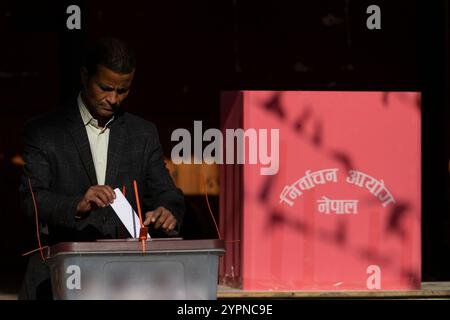 On December 1, 2024, in Kathmandu, Nepal. A man casts his vote at the polling station during Nepal's local by-election. According to the Election Commission of Nepal, a total of 44 vacant seats are available for contest across the country. (Photo by Abhishek Maharjan/Sipa USA) Credit: Sipa USA/Alamy Live News Stock Photo