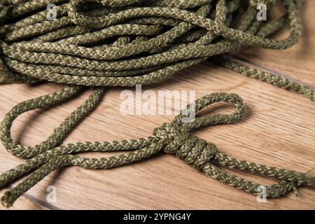 Eight knot on a rope on a blue background close up Stock Photo