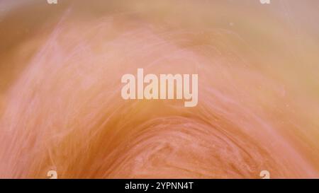 Blur glitter. Ink swirl. Defocused orange pink color vapor cloud bright particles paint texture floating in water on abstract art background. Stock Photo