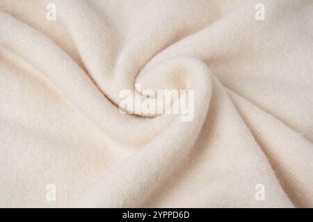 Beige sweater texture as a background. Top view. Stock Photo