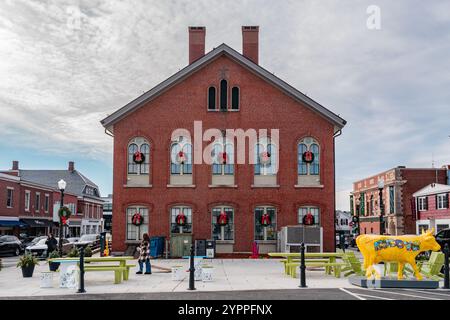 Andover, MA, US-November 27, 2024:  Andover's historic Old Town Hall building on Main Street with public art. Stock Photo