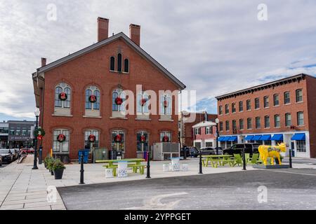 Andover, MA, US-November 27, 2024:  Andover's historic Old Town Hall building on Main Street with public art. Stock Photo