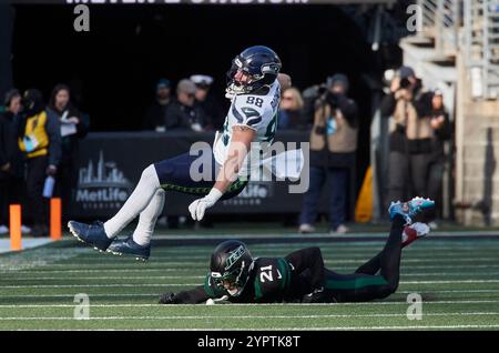 East Rutherford, New Jersey. 01st Dec, 2024. Seattle Seahawks tight end AJ Barner (88) is tackled by New York Jets safety Ashtyn Davis (21) during a NFL game at MetLife Stadium in East Rutherford, New Jersey. Duncan Williams/CSM Credit: Cal Sport Media/Alamy Live News Stock Photo