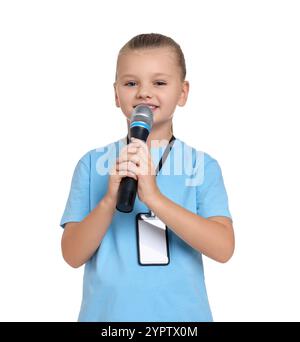 Little girl with microphone pretending to be journalist on white background. Dreaming of future profession Stock Photo