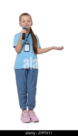 Little girl with microphone pretending to be journalist on white background. Dreaming of future profession Stock Photo