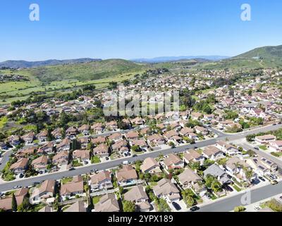 Aerial view of upper middle class neighborhood with residential subdivision mansion and swimming pool during with blue sky in San Diego, California, U Stock Photo