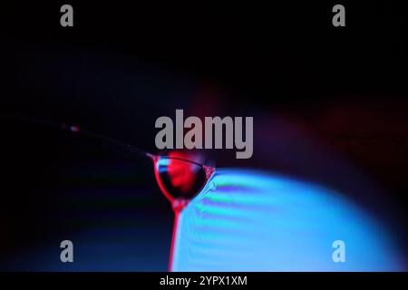 Red and purple fluid panels, liquid abstraction, colour waves, deep dark backgrounds, fantastic perfect forms Stock Photo