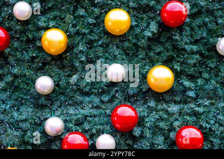 Christmas baubles on an artificial tree background Stock Photo