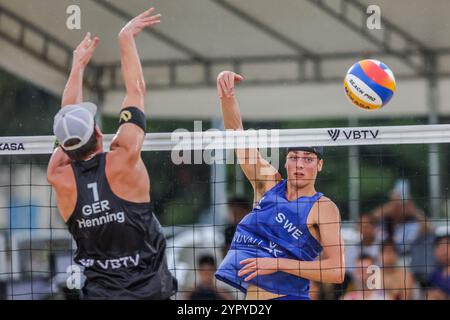 Laguna Province. 1st Dec, 2024. Elmer Andersson (R) of Sweden competes against Paul Henning of Germany during the Men's final between Jacob Holting Nilsson/Elmer Andersson of Sweden and Paul Henning/Tamo Wust of Germany at the 2024 Volleyball World Beach Pro Tour Challenge in Laguna Province, the Philippines on Dec. 1, 2024. Credit: Rouelle Umali/Xinhua/Alamy Live News Stock Photo