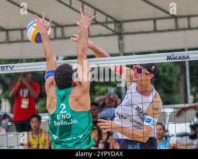 Laguna Province. 1st Dec, 2024. Timo Hammarberg (R) of Austria competes against Joaquin Bello of England during the Men's 3rd place match between Javier Bello/Joaquin Bello of England and Philipp Waller/Timo Hammarberg of Germany at the 2024 Volleyball World Beach Pro Tour Challenge in Laguna Province, the Philippines on Dec. 1, 2024. Credit: Rouelle Umali/Xinhua/Alamy Live News Stock Photo