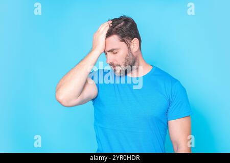 Man suffering from headache. Tired, headache and eye strain. Man with stress, burnout and fatigue eyestrain. Vision problem bad sight. Headache pain Stock Photo