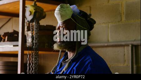 Thoughtful worker standing in foundry workshop Stock Photo