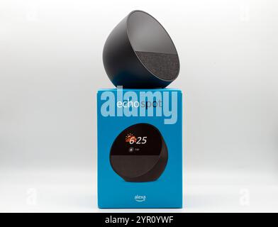 Amazon Echo Spot. Alexa, virtual assistant AI isolated on white background with package. Stock Photo