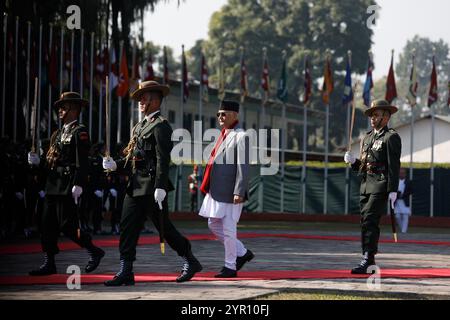 Kathmandu, Kathmandu, Nepal. 2nd Dec, 2024. Nepal Prime Minister KP Sharma Oli (in red scarf) inspects guard of honor before he departs for four days China tour at Tribhuvan International Airport in Kathmandu on 2nd December, 2024. The Nepali Prime Minister in his first official visit to China after coming to power in July is expected to sign the BRI pact with the northern neighbor. (Credit Image: © Aryan Dhimal/ZUMA Press Wire) EDITORIAL USAGE ONLY! Not for Commercial USAGE! Stock Photo