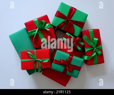 Set of gifts on white background. Traditional Christmas red and green colors. Boxes of different sizes. Tied with ribbons and bows. Red boxes have gre Stock Photo