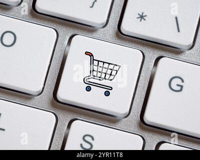 Online shopping and e-commerce concept. Computer keyboard with shopping cart button. Stock Photo