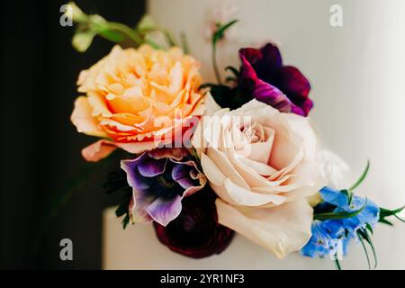Close up of wedding cake adorned with beautiful real roses Stock Photo