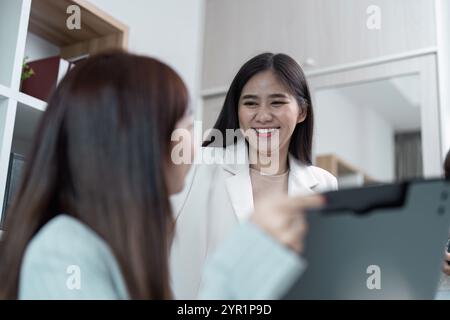 Professional Business Meeting in Modern Office with Diverse Team Collaborating and Discussing Innovative Strategies for Success Stock Photo