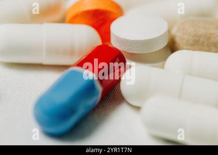 Macro photo of several pills and capsules on white background Stock Photo