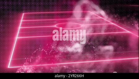 Digital image of soccer field with glowing pink lines and particles Stock Photo