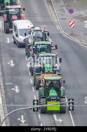 Dresden, Germany. 02nd Dec, 2024. Saxon farmers drive with tractors on Magdeburger Straße to the state parliament to hand over a letter of protest to the state government. The farmers demand the renegotiation of the Mercosur agreement and the introduction of mandatory origin labeling for all foodstuffs. Credit: Robert Michael/dpa/Alamy Live News Stock Photo