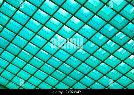 Geometric abstract green glass pattern details the translucent roof of architecture, abstract background Stock Photo