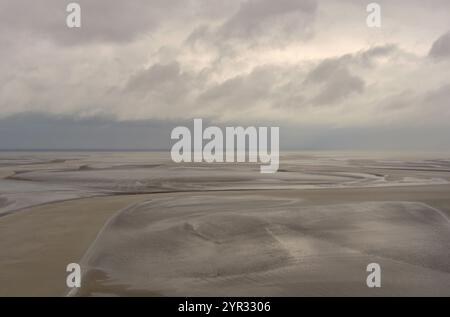 Mont Saint-Michel lies between Normandy and Brittany and is known for low tides. Charm in the old town at the foot of the Benedictine Abbey Stock Photo