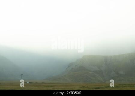 Icelandic mountains shrouded in clouds, creating a mystical atmosphere Stock Photo