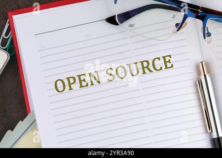 OPEN SOURCE words it is written in the business book in close-up, top view. Stock Photo