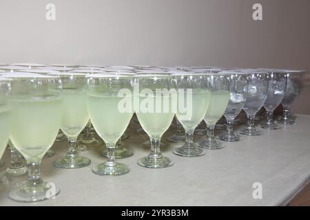 Refreshing Lemonade and Water Glasses on Buffet Table – Elegant Beverage Display Stock Photo