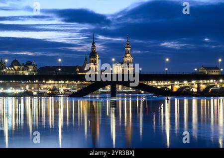 Dresden, Germany. 02nd Dec, 2024. Evening view of the collapsed Carolabrücke bridge in front of the historic old town on the Elbe. The western section of the bridge with streetcar tracks, cycle path and footpath collapsed on the night of September 11, 2024 for reasons as yet unknown. Credit: Robert Michael/dpa/Alamy Live News Stock Photo