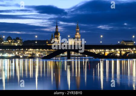 Dresden, Germany. 02nd Dec, 2024. Evening view of the collapsed Carolabrücke bridge in front of the historic old town on the Elbe. The western section of the bridge with streetcar tracks, cycle path and footpath collapsed on the night of September 11, 2024 for reasons as yet unknown. Credit: Robert Michael/dpa/Alamy Live News Stock Photo