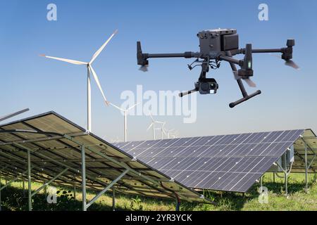 Industrial drone inspects solar panels. Stock Photo