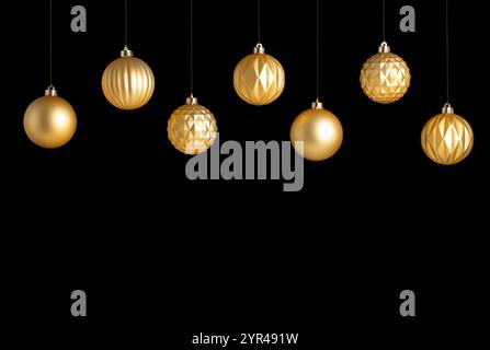 Hanging golden matt Christmas balls with different texture on black background Stock Photo