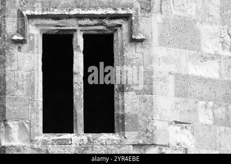 Titchfield Abbey, Hampshire, England. 18 August 2024. Grayscale, close up of a medieval window. Stock Photo