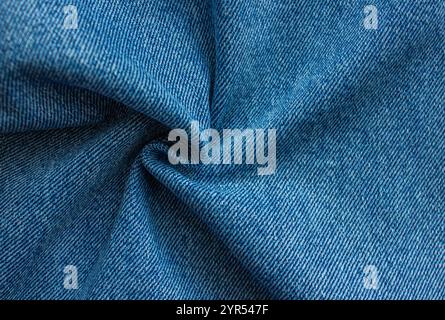 Blue Jeans Background Pattern. Classic twisted denim texture. Creases of jeans texture with Copy space. Stock Photo