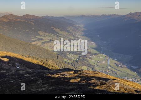 Panoramic view over a sun-drenched valley, surrounded by mountains and distant views, Bramberg am Wildkogel, Salzburg, Austria, Europe Stock Photo