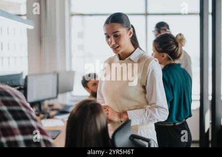 Business professionals collaborating in a modern office setting meeting Stock Photo