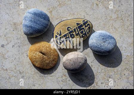 Stone from Tibet with characters, Om mani padme hum, souvenir in Germany Stock Photo