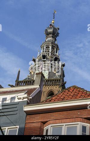 Baroque bell tower with weather vane on a brick building under a blue sky, nijmegen, waal, gelderland, netherlands Stock Photo