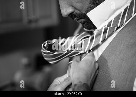 Groom Getting Ready - Close-up of Hands Adjusting Tie on Wedding Day Stock Photo