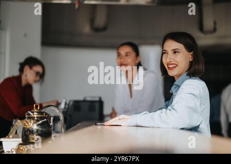 Business workers enjoying a casual break at modern office space Stock Photo