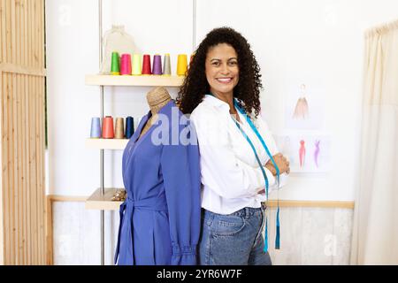 Creative designer in a stylish office space working on fashion designs Stock Photo