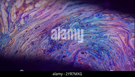 Marble texture. Stain bubble oil. Defocused multicolor purple green liquid paint curve acrylic slick on dark black blurred light abstract art background. Stock Photo