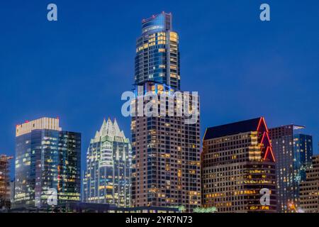 Illuminated city skyline buildings of Austin Texas. Photo taken in the evening during a late twilight blue hour Stock Photo