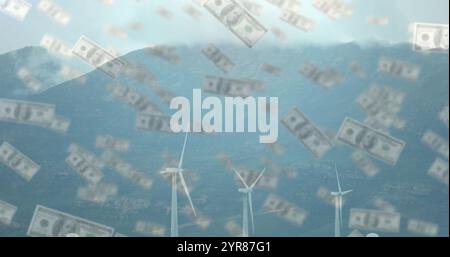 Falling dollar bills image over wind turbines in mountainous landscape Stock Photo