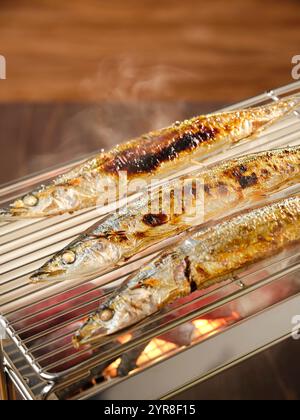 Grilled Sanma (saury) over Binchotan charcoal Stock Photo