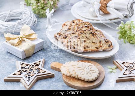 Christmas stollen on wooden background. Traditional Christmas German dessert  with nuts, raisins with marzipan Stock Photo