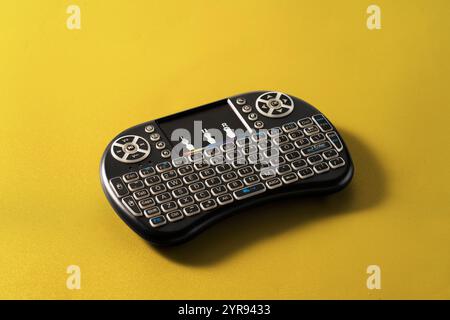 A remote control in the form of a keyboard to control a TV box Stock Photo
